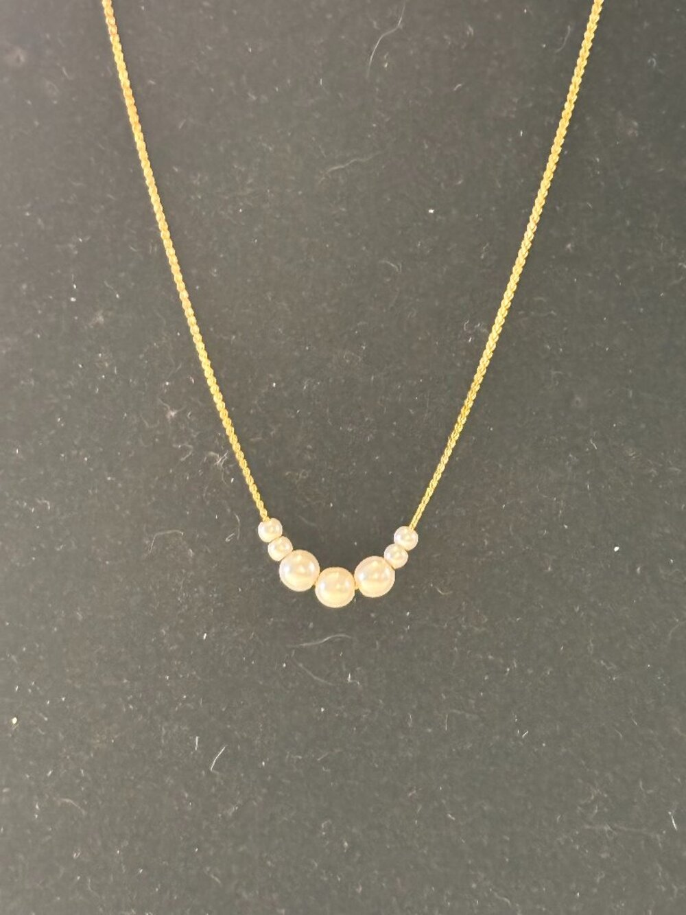 Gold Tone Delicate Chain with Gradient of 7 Faux Pearls Necklace